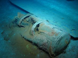 Steel plate and cylindrical tank on seabed. Top of B turret?